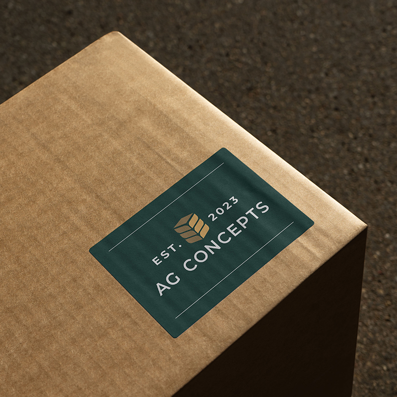 Cardboard box with branded Ag Concepts shipping label in green and gold.