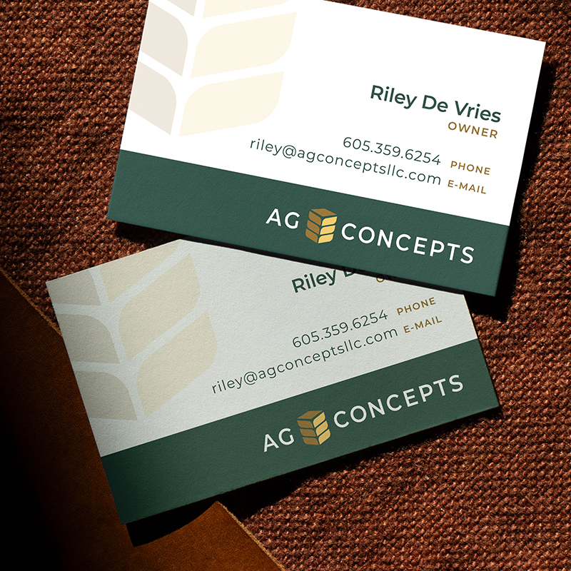 Two business cards for Ag Concepts featuring their logo, colors, and modern layout.