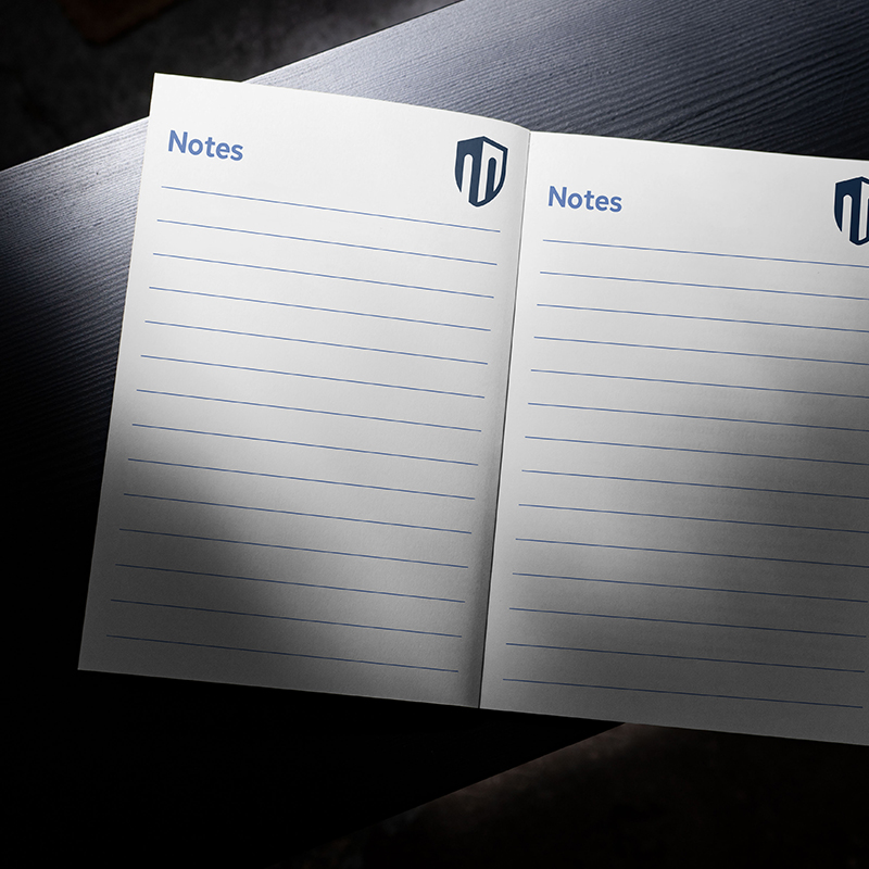 Open lined notebook featuring the Castle Insurance Group logo in the corner of each page.
