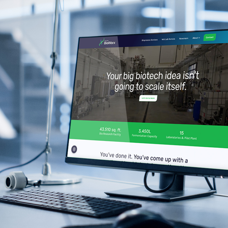 Dakota BioWorx website homepage on a desktop computer screen, showing the headline “Your big biotech idea isn’t going to scale itself.”
