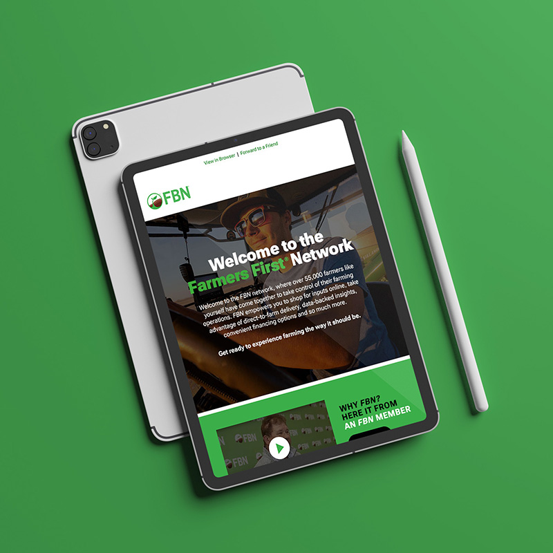 Tablet displaying an FBN email with the headline “Welcome to the Farmers First® Network.”