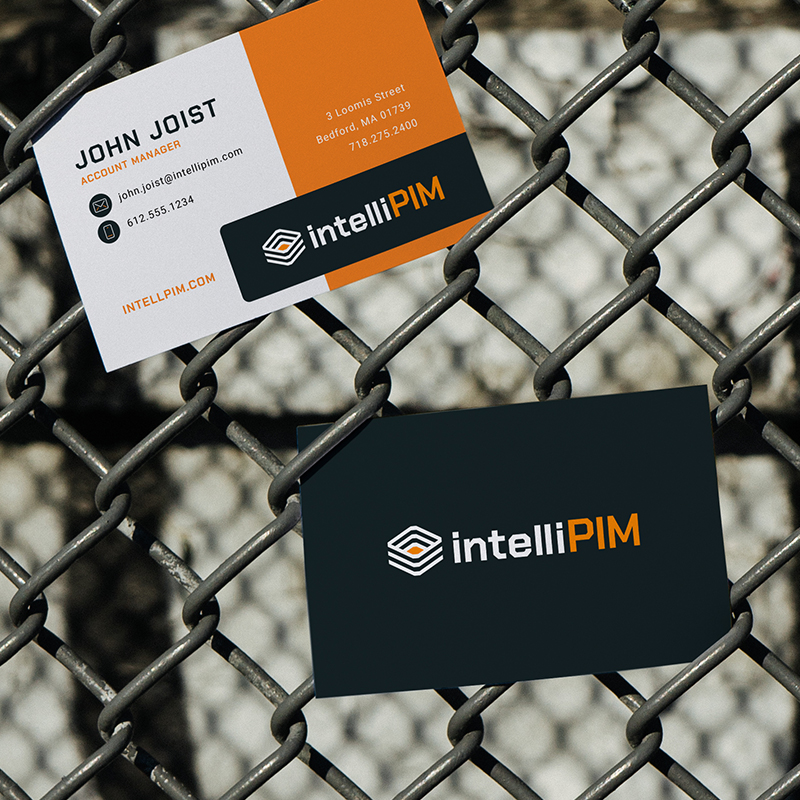 Branded IntelliPIM business cards in orange and gray featuring the new logo and color system.